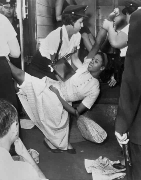African-American-Woman-Being-Carried-to-Police-Patrol-Wagon-During-Demonstration